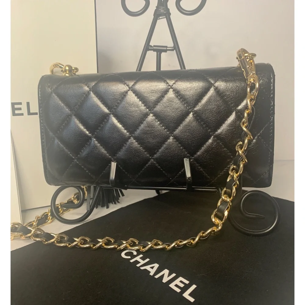 CHANEL Black Quilted Lambskin Crossbody with Gold Chain & Tassel Accent